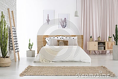 Spacious bedroom with cactus motif Stock Photo