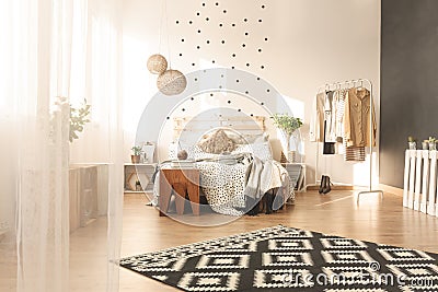 Spacious bedroom with carpet Stock Photo