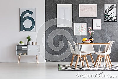 Spacious dining room with posters Stock Photo