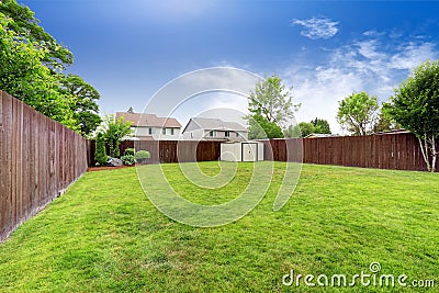 Spacious fenced backyard with shed Stock Photo