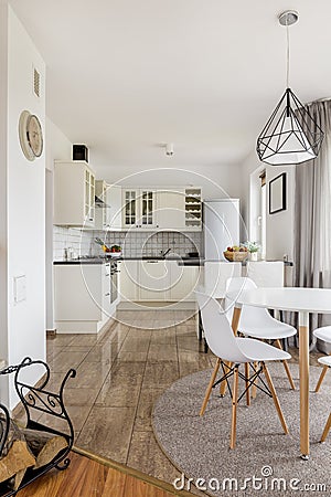 Spacious kitchen, stylish dining room Stock Photo