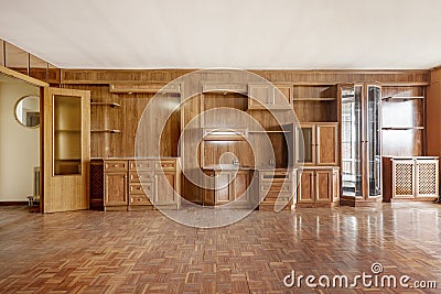 Spacious room with wooden mural covering one wall with parquet wood Stock Photo