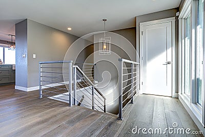 Spacious upstairs landing with gray walls Stock Photo