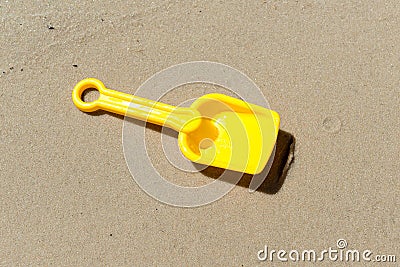 Spade digs wet sand Stock Photo