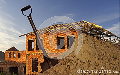 Spade,sand and house Stock Photo