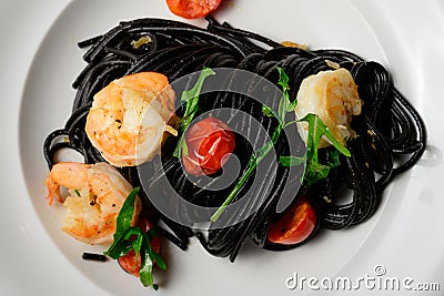 Spaghetti al Nero di Seppia with Squid Ink and Prawns Stock Photo
