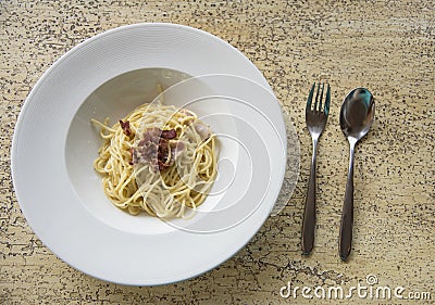 Spaghetti with becon on table Stock Photo