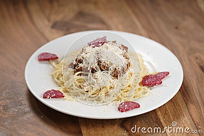 Spaghetti bolognese with fuet sausage Stock Photo