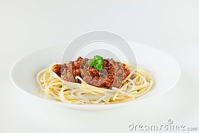 Spaghetti Bolognese with parsley in white plate Stock Photo
