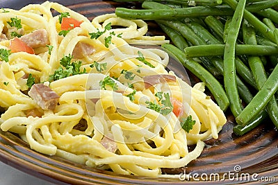 Spaghetti carbonara and beans Stock Photo