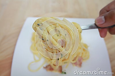 Spaghetti carbonara with cream on white plate Stock Photo