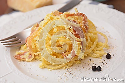 pasta Spaghetti carbonara italian dish with eggs cheese ham pepper tipical food gourmet Stock Photo