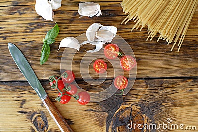 Spaghetti, cherry tomatoes and garlic Stock Photo