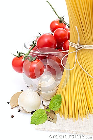 Spaghetti, cherry tomatoes, onions, garlic Stock Photo