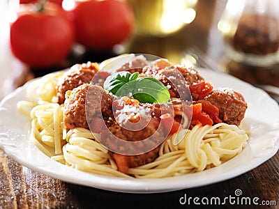 Spaghetti and meatballs with basil garnish Stock Photo