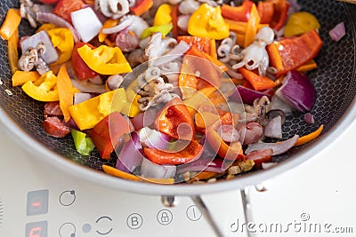 spaghetti with octopus, tomatoes and assorted herbs - Italian food - closeup Stock Photo