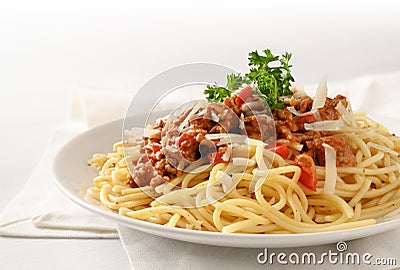 Spaghetti plate with sauce from minced meat and tomato, parmesan Stock Photo