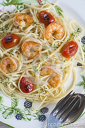 Spaghetti with prawns and grape tomatoes Stock Photo