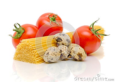 Spaghetti, quail eggs and tomatoes on a white Stock Photo
