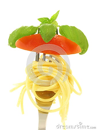 Spaghetti, tomato, basil on fork Stock Photo