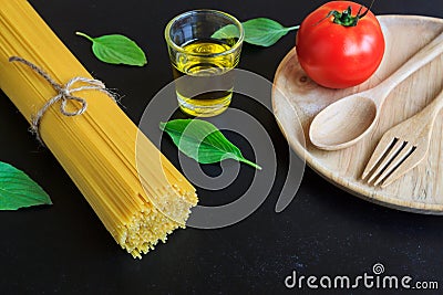 Spaghetti and tomatoes with basil on blackboard Stock Photo