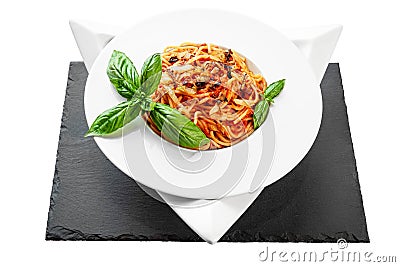 Spaghetti tuna pasta basil plate triangle shape slate table pretty Stock Photo