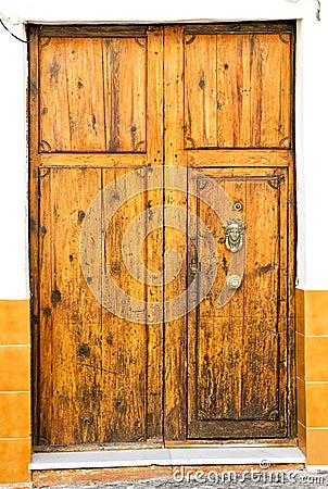 Spain. Ancient knocker on old wood door. Stock Photo