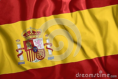 The Spain flag flies in the wind. Colorful national flag of the Spain. Patriotism, patriotic symbol Stock Photo