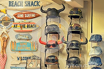 SPAIN, LLORET DE MAR - APRIL 13, 2019: biker helmets with horns in a store window Editorial Stock Photo