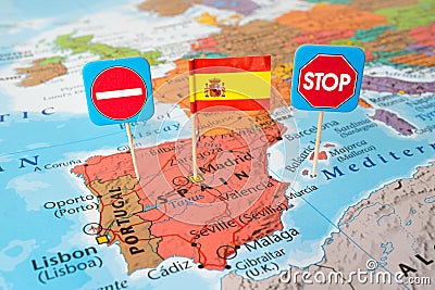 Spain lockdown concept image stop country flag and stop signs on map, travel restrictions border shutdown Stock Photo