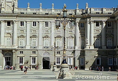 Spain, Madrid, Armory Square (Plaza de la Armeria), Royal Palace of Madrid, forged decorative metal lamp near the palace Editorial Stock Photo