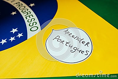 brazilian national flag, notebook, inscription hello in spanish, on the desktop, foreign language learning concept Stock Photo