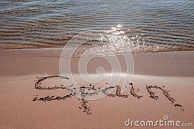 Spain title on the sand beach near the ocean Stock Photo