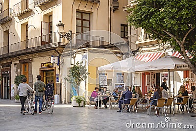 SPAIN, VALENCIA - OCT 16, 2018 : Cafe restaurant Cozy street old town People lifestyle sitting at Tapas Bar food and drink Editorial Stock Photo