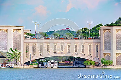 Span of arched bridge over the river. View of the water bridge, shipping construction. Stock Photo