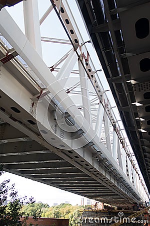 Span of the railway bridge under construction across the Mosvkva river next to the existing bridge Stock Photo