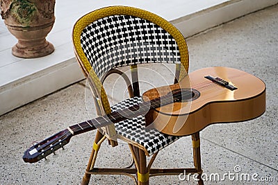 Spanish acoustic guitar on chair Stock Photo