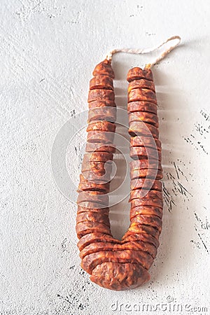 Spanish chorizo on the white background Stock Photo