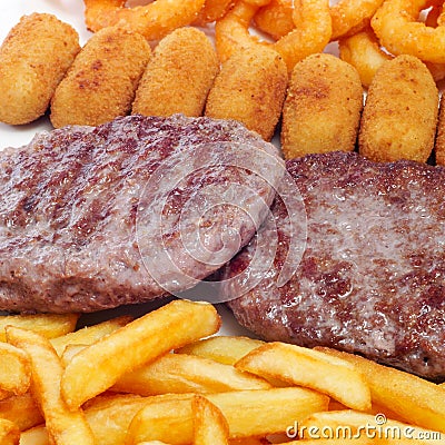 Spanish combo platter with burgers, croquettes, calamares and fr Stock Photo