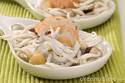 Spanish cuisine. Baby eels in garlic sauce. Stock Photo