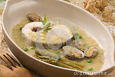 Spanish cuisine. Hake Basque style. Stock Photo