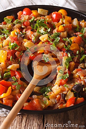Spanish cuisine: vegetable stew Pisto manchego macro on a plate. Stock Photo