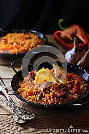 Spanish food specialty - chorizo sausage cooked with rice, tomatio, paprika, Stock Photo