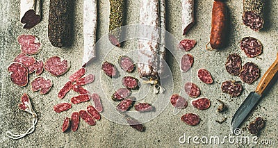 Spanish or Italian cured sausages in slices, wide composition Stock Photo