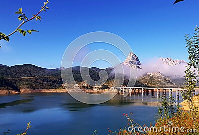 Spanish lake with a mountain in the background Stock Photo