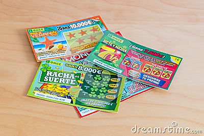 Spanish lottery scratch cards on wooden table. Editorial Stock Photo