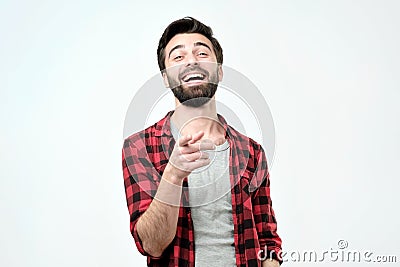 Spanish man mocking you or laughing on his friend joke Stock Photo