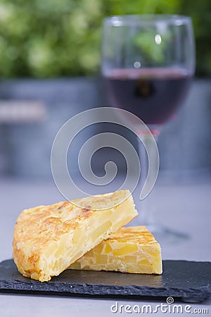 Spanish omelet slices on a dark plate Stock Photo