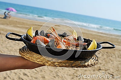 Spanish paella on the beach Stock Photo