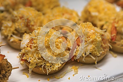 Spanish pintxos Russian salad with shrimp in a Basque bar, San Sebastian, Spain Stock Photo